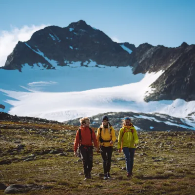 Friends walking in mountain in Lyngen